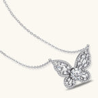 Sterling silver butterfly pendant with radiating design and central moissanite stone on adjustable chain