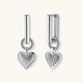 Platinum-plated 925 sterling silver rectangular hoop earrings with twisted ring connector and ribbed heart charm pendant.