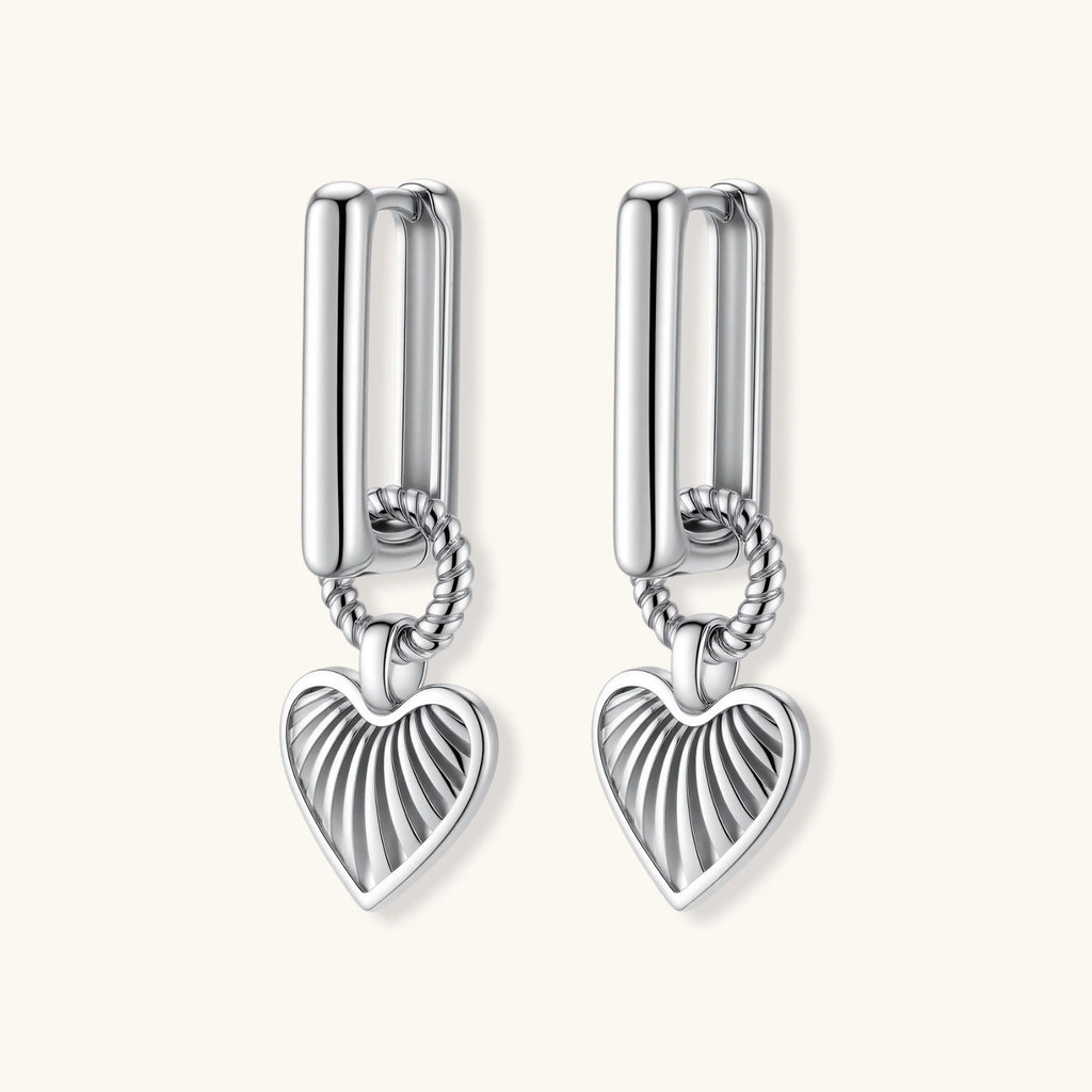 Platinum-plated 925 sterling silver rectangular hoop earrings with twisted ring connector and ribbed heart charm pendant.