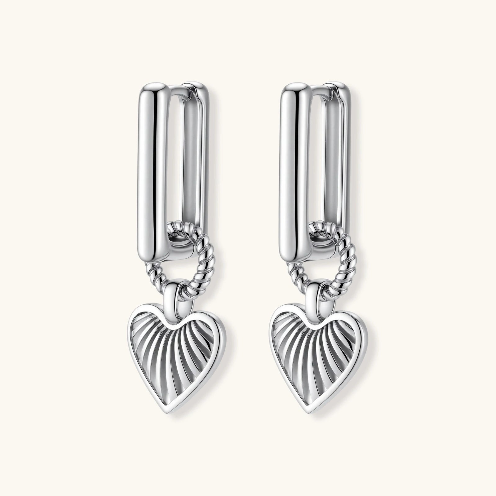 Platinum-plated 925 sterling silver rectangular hoop earrings with twisted ring connector and ribbed heart charm pendant.
