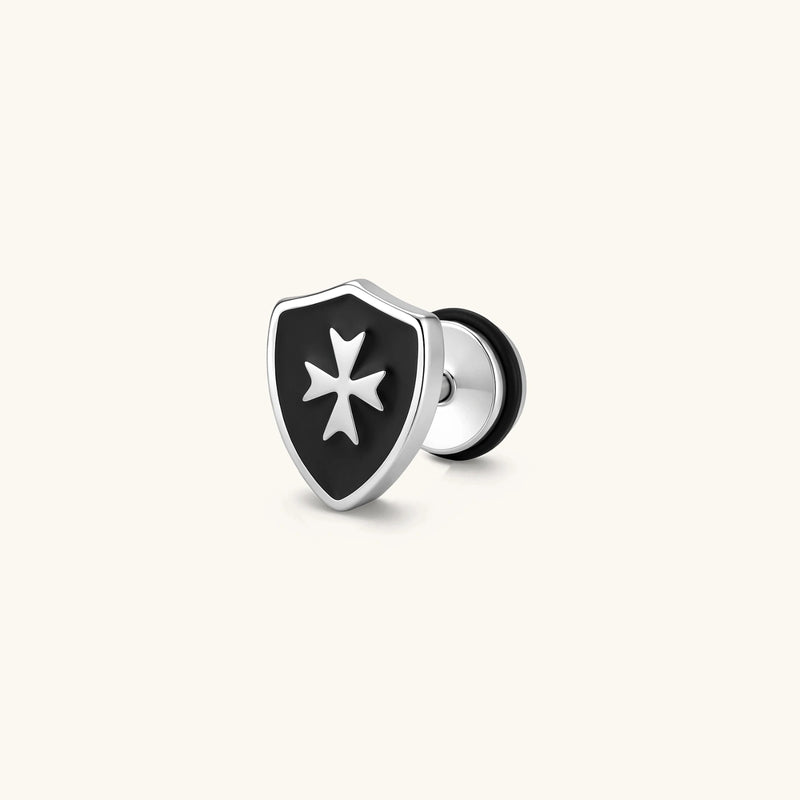 Silver stainless steel shield-shaped stud earring with black enamel and raised Maltese cross, rubber-secured backing.